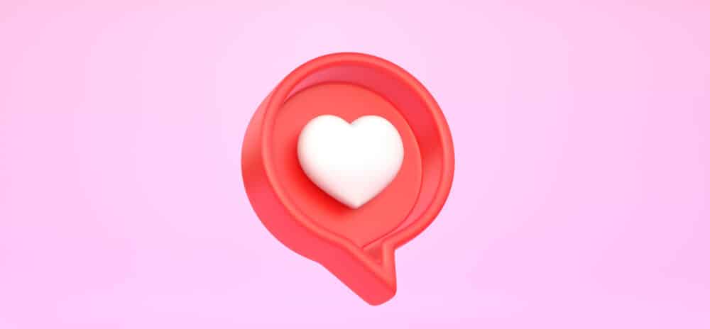 Heart in speech bubble icon on a pink background