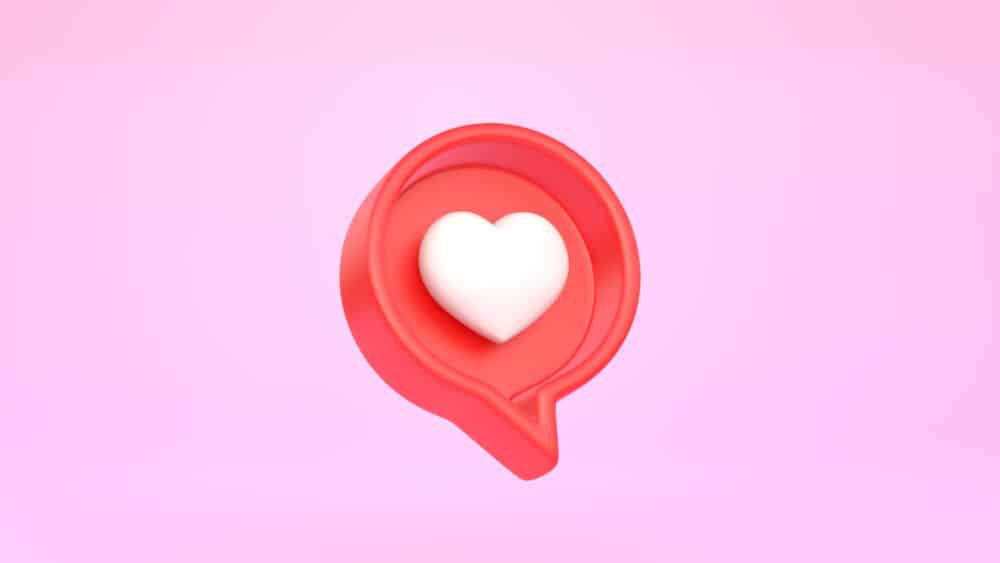Heart in speech bubble icon on a pink background