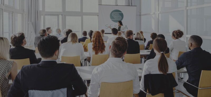 SESCA event with audience listening to a speaker presentation