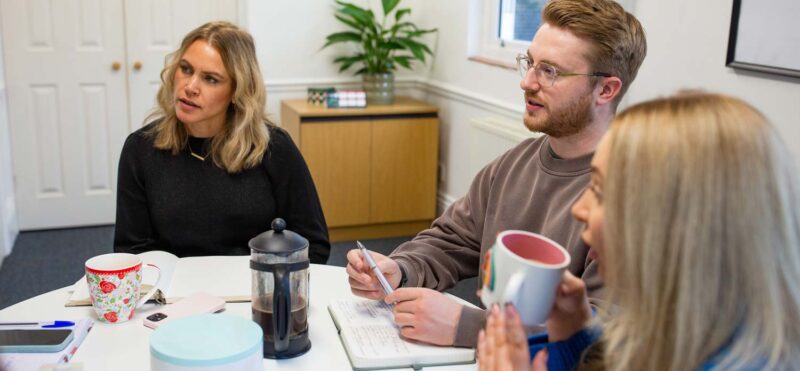 Marketing agency team discussing campaign ideas during a collaborative meeting