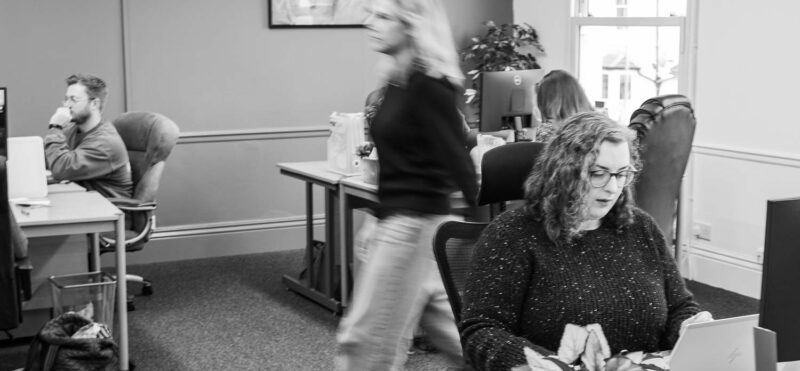 Marketing agency office with team members focused on work in a fast paced environment