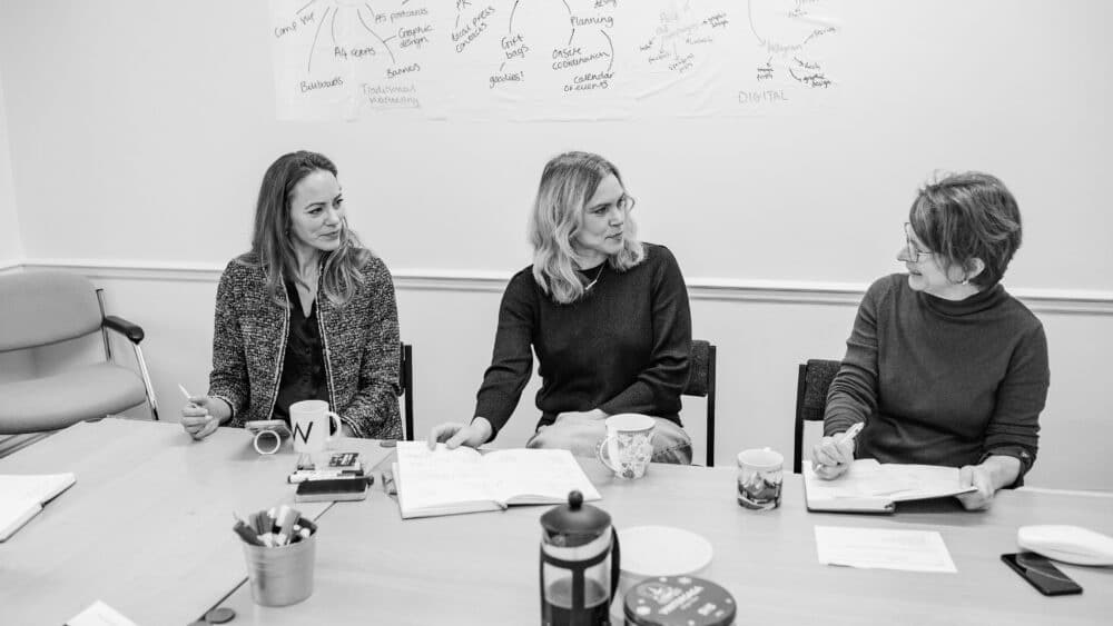 Black and white photo of Your Marketing Team, from left to right pictured is: Laura Taylor PR Consultant, Beccy Tombs Lead Consultant, Sue Land Founder & Lead Consultant