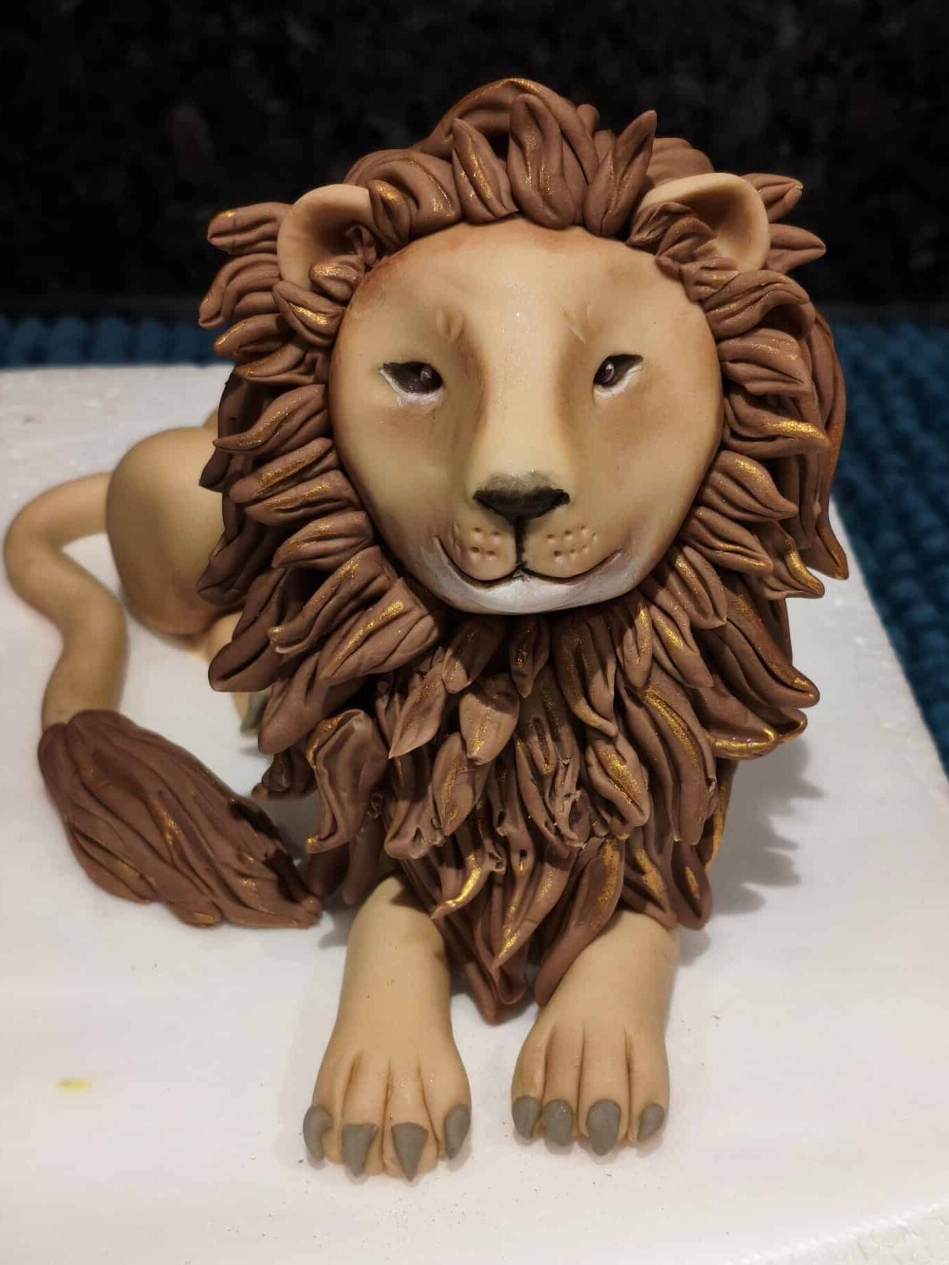 Lion fondant topper for a Narnia-themed cake. 