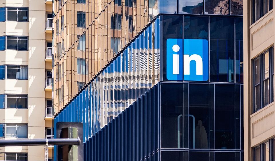LinkedIn building in San Francisco. The building is glass and had the LinkedIn blue icon on the building.