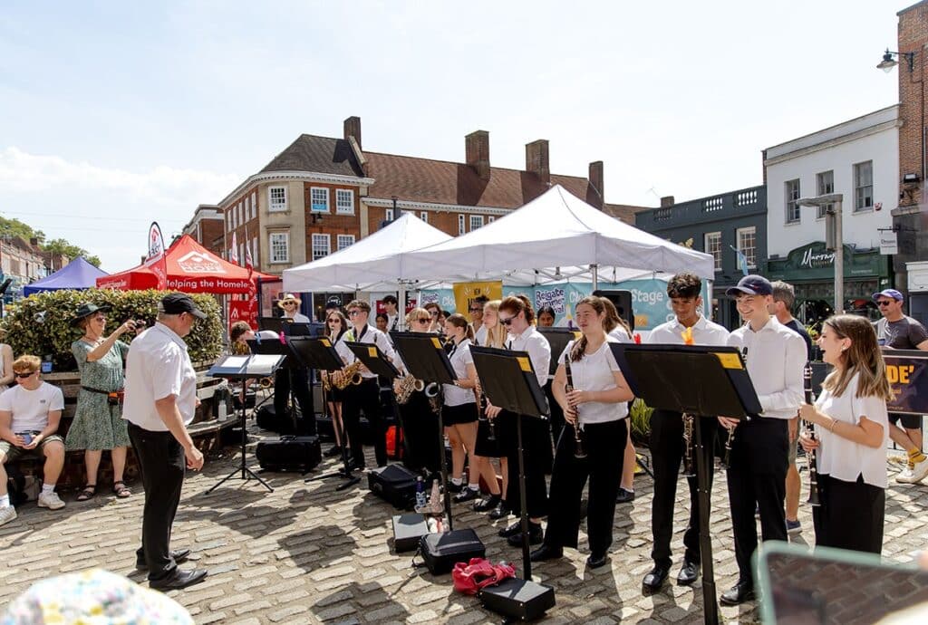 Musicians performing on Reigate High Street as part of Reigate Summer Festival. 